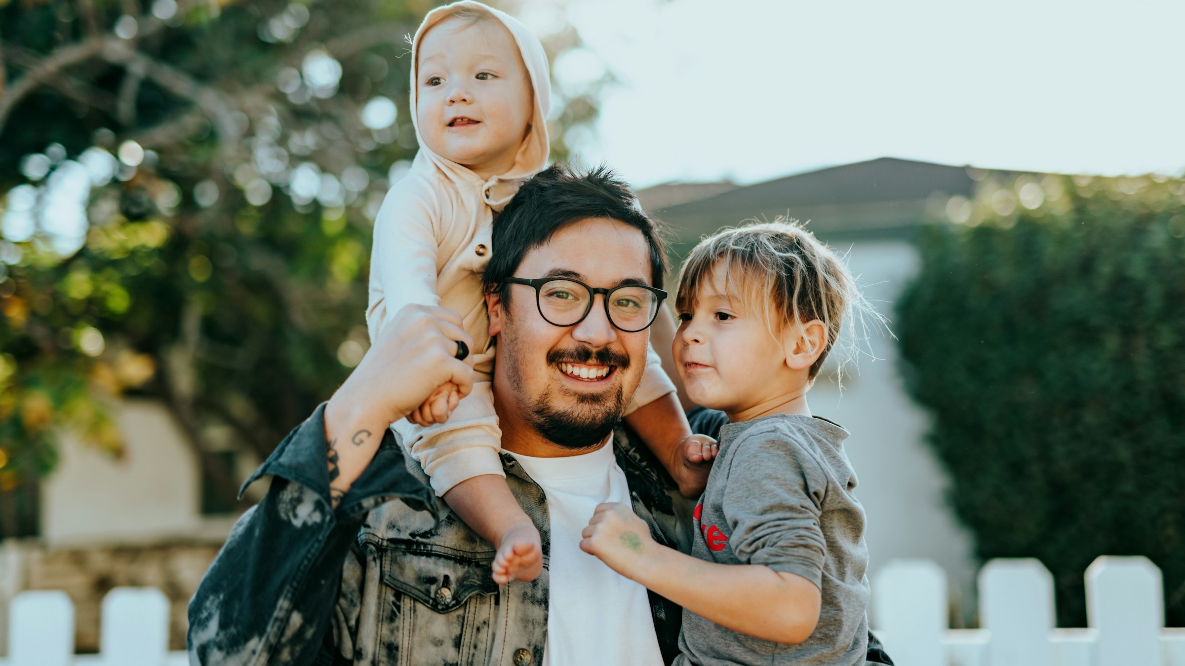 A family smiling together in a bright home