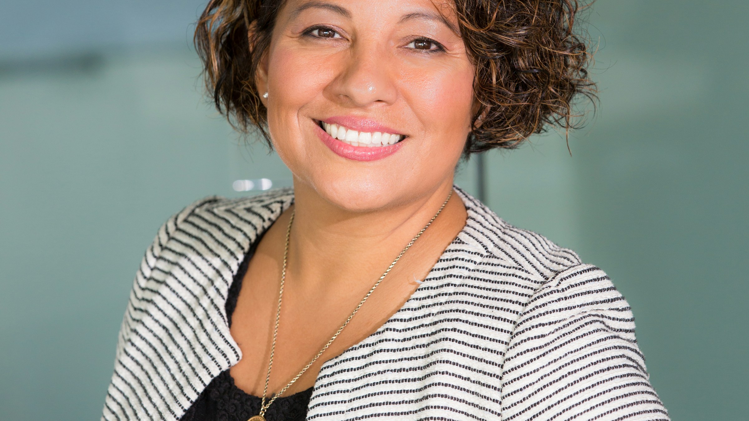 Professional woman smiling in an office setting